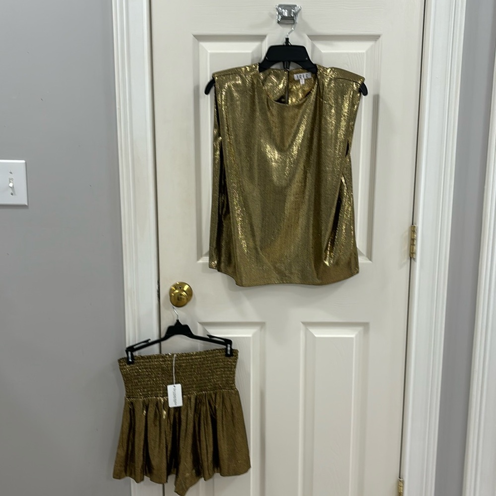 2 piece, gold lame top & shorts.